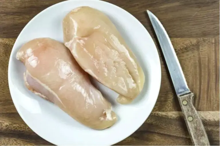 Raw thin chicken breasts ready for baking at 350 degrees