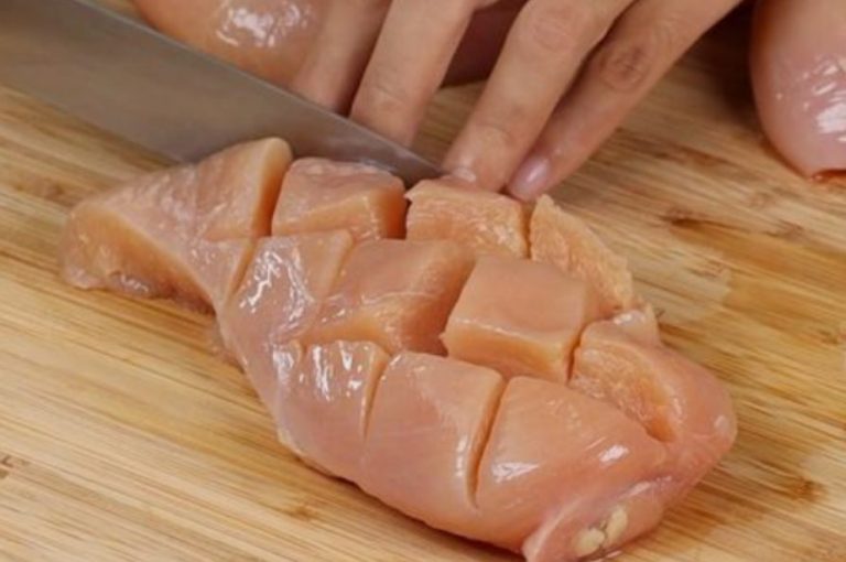 Freshly cooked calories in chicken breast slices on a cutting board