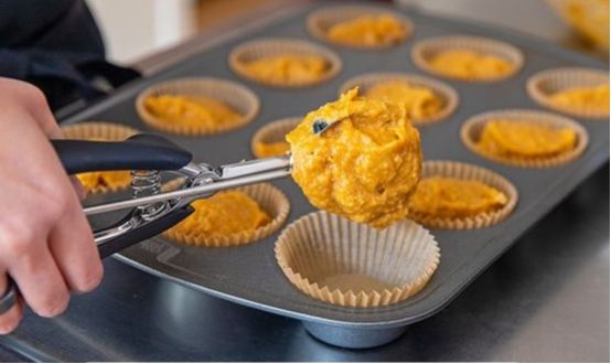 Ingredients for gluten-free pumpkin muffin recipe, including pumpkin puree, gluten-free flour, and spices.